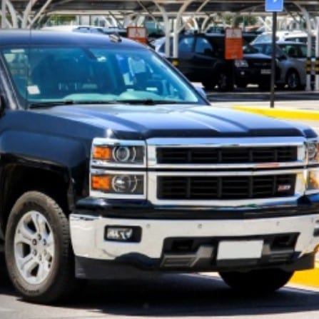 Image of a modern day Black Chevy Truck in a parking lot